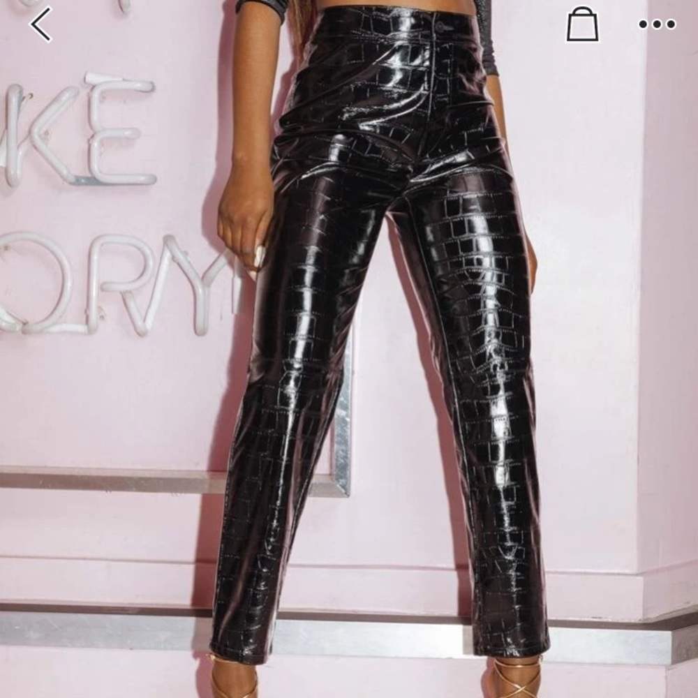 Black leather like pants.